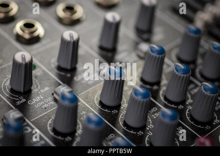 Professional Audio Mixing Console input gain control knobs and audio eq controls Stock Photo