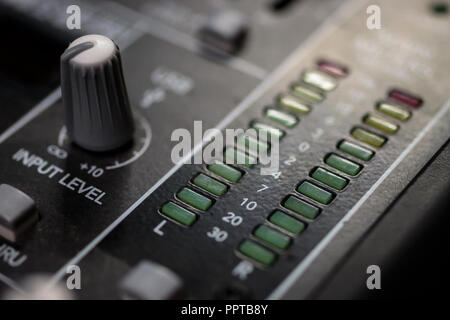 Pro Audio Master signal output meters and input control on a professional sound mixing console/ desk Stock Photo