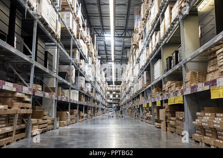 Shoppers looking for flat packed furniture on the racks of shelves in a warehouse in Miami, USA Stock Photo