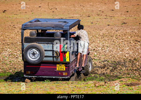 Safari jeep stuck in mud on safari in Udawalawe National Park in Sri Lanka Stock Photo