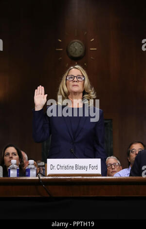 September 27, 2018 - Washington, DC, U.S. - WASHINGTON, DC - SEPTEMBER 27:  Christine Blasey Ford is sworn in before testifying the Senate Judiciary Committee in the Dirksen Senate Office Building on Capitol Hill September 27, 2018 in Washington, DC. A professor at Palo Alto University and a research psychologist at the Stanford University School of Medicine, Ford has accused Supreme Court nominee Judge Brett Kavanaugh of sexually assaulting her during a party in 1982 when they were high school students in suburban Maryland. In prepared remarks, Ford said, Ã’I donÃ•t have all the answers, and  Stock Photo