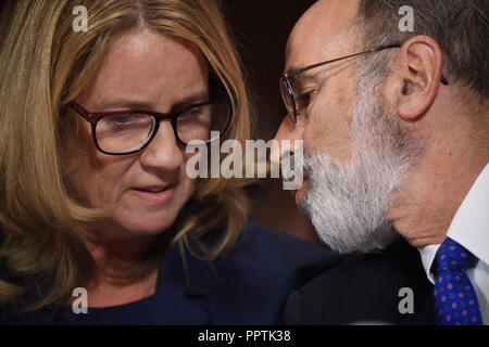 Washington, United States. 27th Sep, 2018. Christine Blasey Ford (L), the woman accusing Supreme Court nominee Brett Kavanaugh of sexually assaulting her at a party 36 years ago, confers with her attorney Michael R Bromwich (R) as she testifies before the US Senate Judiciary Committee on Capitol Hill in Washington, DC, September 27, 2018. /POOL/SAUL LOEB/dpa/Alamy Live News Stock Photo