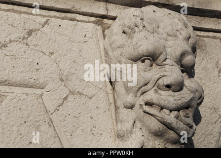 Grotesque in Venice. Bizarre monster guardian head on Santa Formosa Church bell tower (17th century) Stock Photo