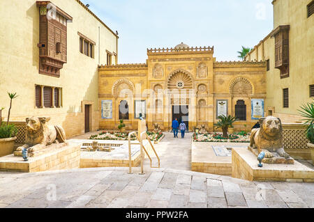 CAIRO, EGYPT - DECEMBER 23, 2017: The beautiful entrance to the Coptic Museum decorated with carved patterns and sculptures of the lions before it, on Stock Photo