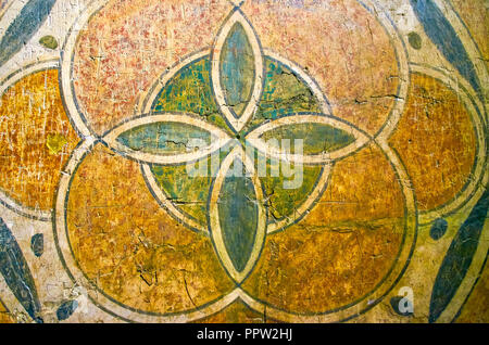 CAIRO, EGYPT - DECEMBER 23, 2017: The beautiful painted geometric tracery on the marble plate in Coptic Museum, on December 23 in Cairo Stock Photo