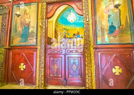 CAIRO, EGYPT - DECEMBER 23, 2017:  The wooden iconostasis with doors to altar in Assumption Church in Coptic neighborhood, on December 23 in Cairo Stock Photo