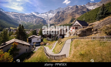On a late september day the sun is shining on Saas-Fee, the main village in the Saastal, or the Saas Valley Stock Photo