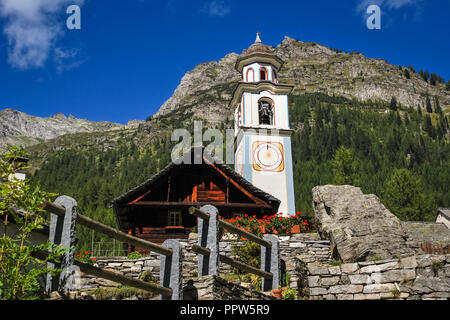 A view on the church of the small village of Bosco Gurin located in the Val Maggia in Ticino, Switzerland. Stock Photo