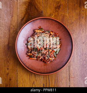 Stewed vegetables seasoned with sesame seeds in a restaurant Stock Photo