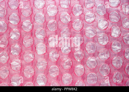 Premium Photo  Packaging with air bubbles on a pink background. bubble wrap  texture, packaging, air bubble film. top view. copy, empty space for text