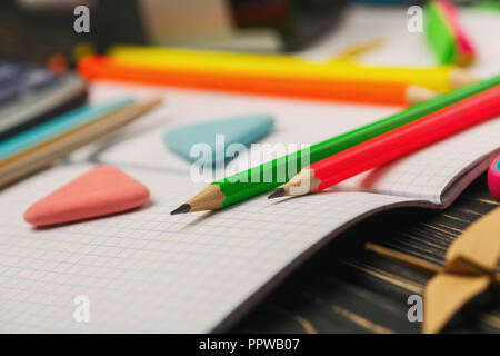 Bright crayons lie on a notebook. Education concepte Stock Photo