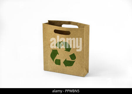 Paper shopping eco bag with green recycle symbol on white background Stock Photo