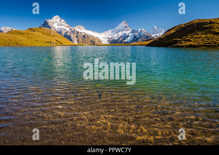 Encountering Bachalpsee during the famous hiking trail from First to Grindelwald (Bernese Alps, Switzerland). Stock Photo