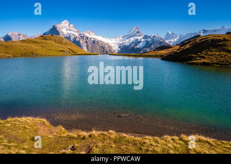 Encountering Bachalpsee during the famous hiking trail from First to Grindelwald (Bernese Alps, Switzerland). Stock Photo