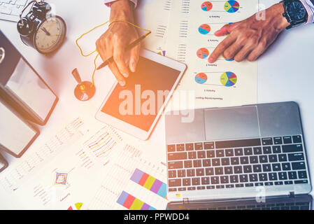 Business meeting time. Photo young account managers crew working with new startup project. Notebook on wood table. Idea presentation, analyze plans Stock Photo