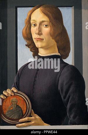 Botticelli - Portrait of a young man holding a medallion. Stock Photo