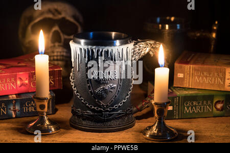 Official House Stark tankard from Game of Thrones series lit by candlelight Stock Photo