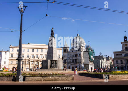 Lodz, Poland : View of Plac Wolnosci Freedom square with incidental people and the Church of the Descent of the Holy Ghost in background. Stock Photo