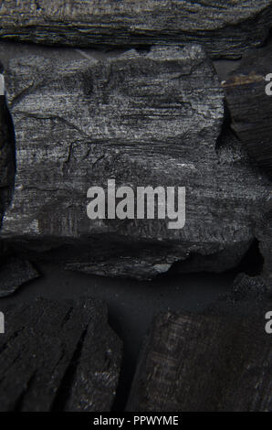 Carbon on an isolated black background, abstract art for backgrounds for advertising texts. Stock Photo