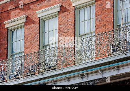 A wrought iron balcony is pictured in the French Quarter in New Orleans, Louisiana. Stock Photo