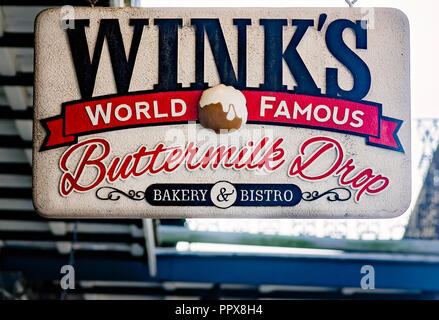 The Wink’s Buttermilk Drop Bakery sign hangs outside the French Quarter restaurant in New Orleans, Louisiana. Stock Photo