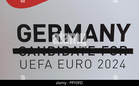 28 September 2018, Hessen, Frankfurt Main: On a poster with the inscription 'Germany Candidate for Uefa Euro 2024' the words 'Candidate for' are crossed out for the employees and the delegation at a reception at the headquarters of the German Football Association (DFB). The day before, the Uefa had awarded the 2024 European Soccer Championship to Germany. Photo: Arne Dedert/dpa Stock Photo