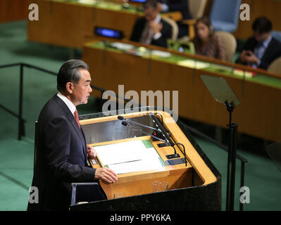 United Nations. 28th Sep, 2018. Chinese State Councilor and Foreign Minister Wang Yi addresses the General Debate of the 73rd session of the United Nations General Assembly at the UN headquarters in New York, on Sept. 28, 2018. Wang Yi on Friday delivered a speech at the General Debate of the UN General Assembly, endorsing multilateralism, world peace and free trade. Credit: Qin Lang/Xinhua/Alamy Live News Stock Photo