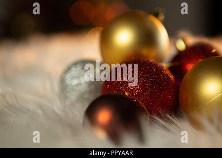 Colored Christmas ornaments on a carpet Stock Photo