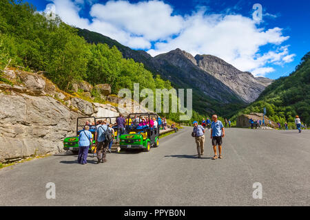 Olden, Norway - August 1, 2018: Troll cars, people on the way to Briksdal or Briksdalsbreen glacier in Olden, Norway Stock Photo