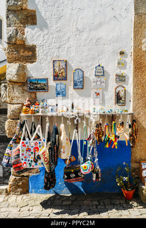 Obidos, Portugal - Sept 25, 2018: Traditional Portuguese souvenirs for sale on display captured in the historic city centre of Obidos, Portugal Stock Photo