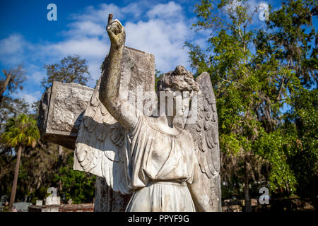Stone angel over a gravesite. Stock Photo