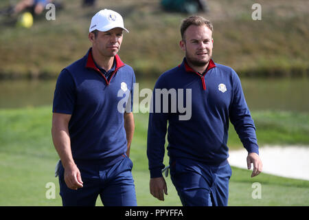 Team Europe's Tyrrell Hattonand Paul Casey (left) on the 16th during the Fourballs match on day one of the Ryder Cup at Le Golf National, Saint-Quentin-en-Yvelines, Paris. Stock Photo