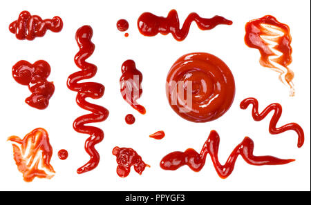 Ketchup splashes, group of objects. Arrangement of red ketchup or tomato sauce, isolated white background, top view. Stock Photo