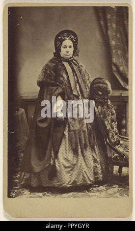 elderly woman wearing a fur coat and hat, standing; Partridge, American, active Bridgeport, Connecticut 1870s - 1890s, 1865 Stock Photo