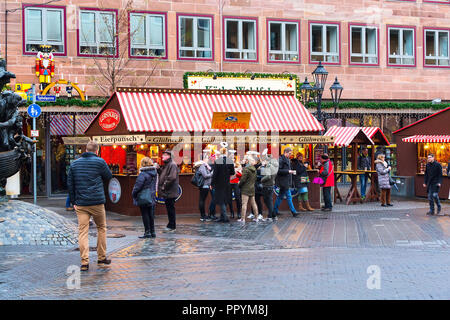 Nuremberg, Germany - December 24, 2016: Christmas market with kiosks and stalls, people in Nuremberg Bavaria Stock Photo