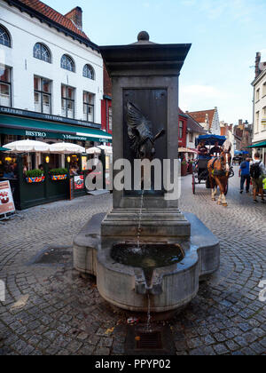 Bronze sculpture of a horse’s head as water fountain - Bruges, Belgium Stock Photo
