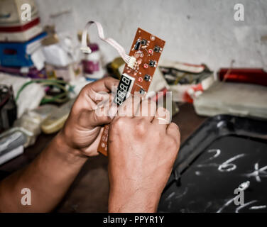 Selective focus. computer hardware development repair and upgrade concept Close-up view. diagnosing or testing digital component. Workshop background Stock Photo