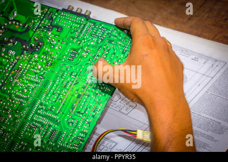 Selective focus. computer hardware development repair and upgrade concept Close-up view. diagnosing or testing digital component. Workshop background Stock Photo