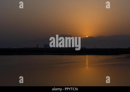 Sunrise over the Jebal Jais Mountain and Ras al Khaimah City Stock Photo