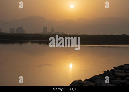 Sunrise over the Jebal Jais Mountain and Ras al Khaimah City Stock Photo