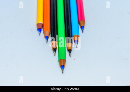 Set of multi-colored pens, tools for writing drawing, isolated on white. Stock Photo
