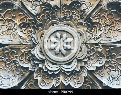 A floral pattern stone caving decoration on the wall in Chengdu Jinli old street, Sichuan province, China. Stock Photo