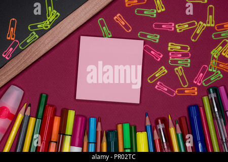 Adhesive notes, blackboard with pencils on colorful background, blank copy space Stock Photo