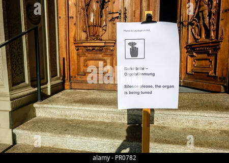 Lucerne, Switzerland - September 24, 2015: A sign is indicating that the organ of the Church of St. Leodegar (Hofkirche), is being tuned. Stock Photo