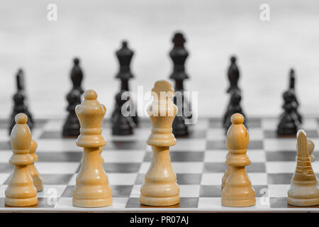 Premium Photo  A set of bright wooden chess pieces placed on a chessboard  in a brick wall background. the concept of business strategy planning. copy  space for text or article. 3d