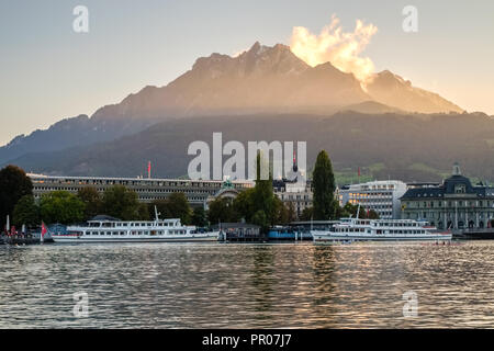 Lucerne, Switzerland – September 24, 2015:  The nice view from the shores of Lake Lucerne (Vierwaldstattersee) towards the mountains Stock Photo