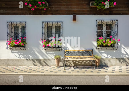 Lauterbrunnen, Switzerland - September 25, 2015: Looking at a typical Swiss porch of a Swiss craft home in the village of Lauterbrunnen Stock Photo