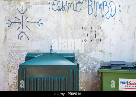 Garbage containers and graffito saying ESKIMO BIMBO, Harbolle Havn on Moen Island, Denmark, Scandinavia, Europe. Stock Photo