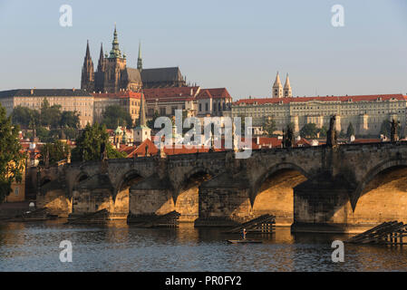 Prague Castle, Hradcany, Mala Strana, and Charles Bridge lit by sunrise, UNESCO World Heritage Site, Prague, Czech Republic, Europe Stock Photo