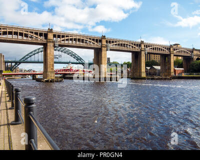 The High level road and rail bridge over the river Tyne with the Tyne bridge in the background Newcastle upon Tyne England UK Stock Photo